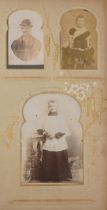 Victorian and later postcards and cabinet cards arranged in an album including soldiers in