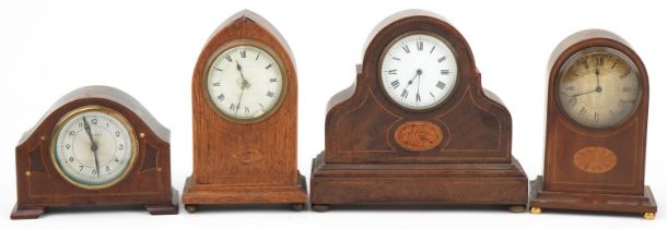 For inlaid mahogany mantle clocks, three with inlay and Roman numerals, the largest 24cm high :