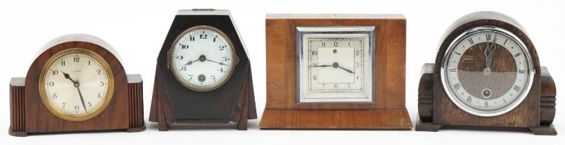 Four Art Deco walnut and oak mantle clocks including Temco, Davall and an eight day example, the