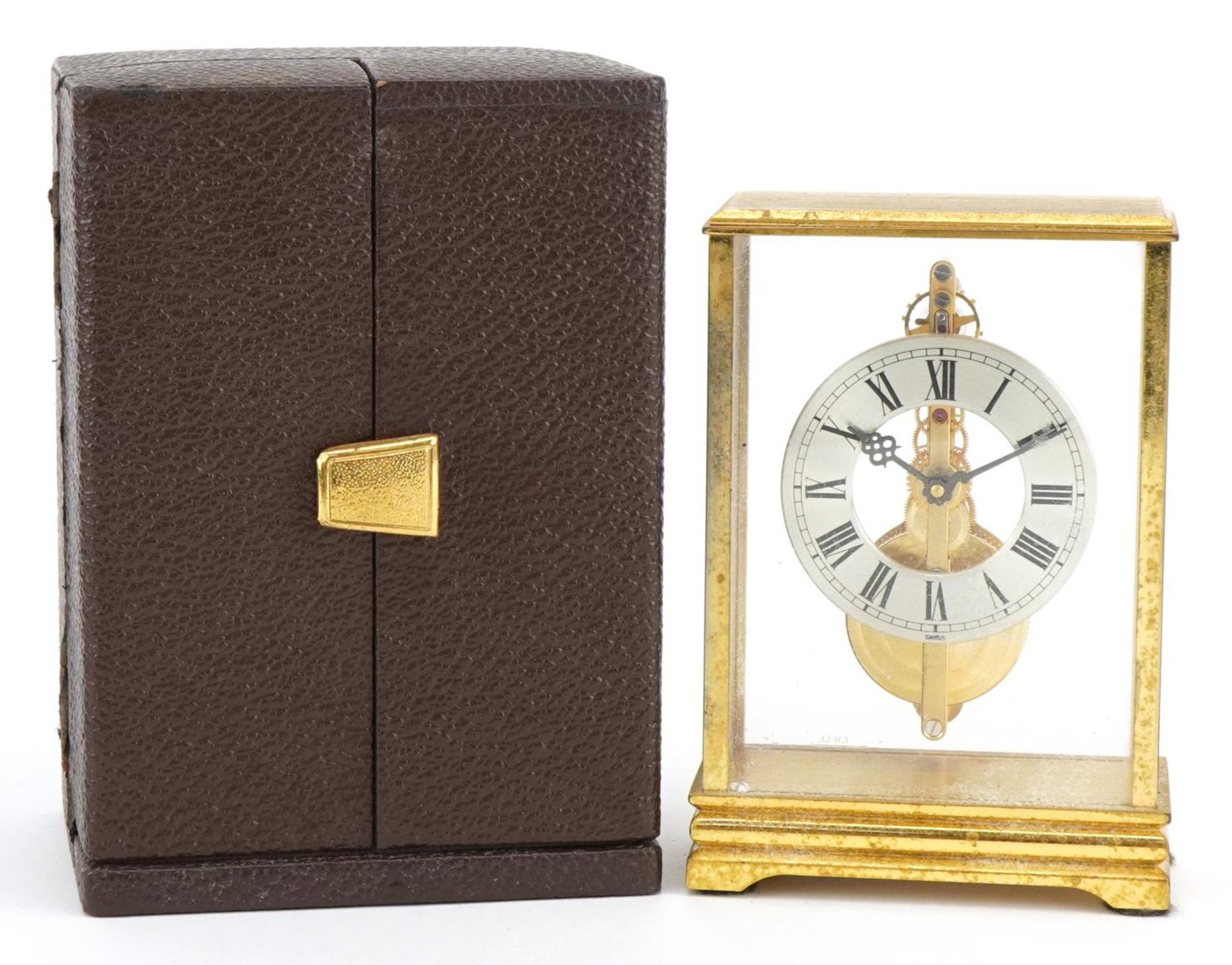 Jaeger LeCoultre, brass cased mystery desk clock with Roman numerals housed in a fitted case, the