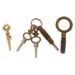 Vintage watch keys including a gold coloured metal example, the largest 4cm in length : For