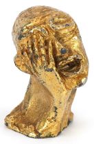 Manner of Salvador Dali, gilt painted cast metal sculpture of a man's head, 6cm high : For further