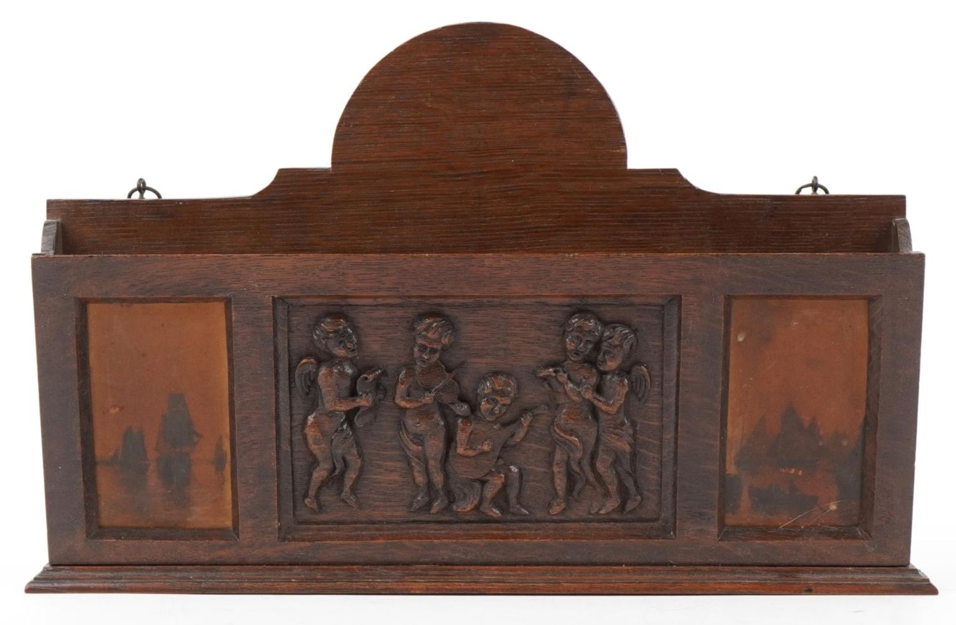 Early 20th century oak letter rack carved with Putti musicians, 46cm wide : For further - Image 2 of 5