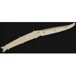 Scrimshaw style carved bone folding knife in the form of a fish, 13cm wide when closed : For further
