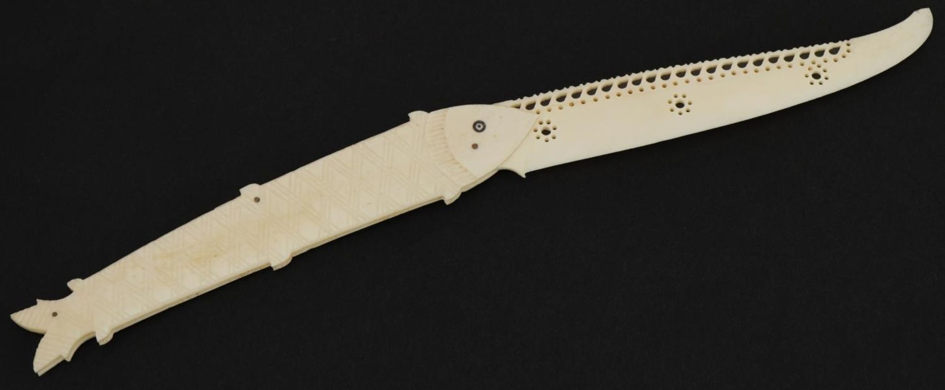 Scrimshaw style carved bone folding knife in the form of a fish, 13cm wide when closed : For further