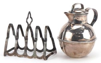 Edwardian silver Jersey cream can and a silver four slice toast rack, the largest 8.5cm high,