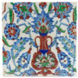 Square Islamic pottery tile hand painted with stylised flowers and foliage, 24.5cm x 24.5cm : For