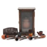 Smoking collectables including an glazed oak smoker's cabinet with terracotta tobacco jar and