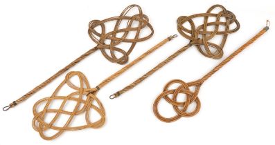 Four early 20th century rattan carpet beaters including a pair, 82cm in length : For further