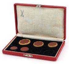 Meissen, five German 1921 Sachsen (Saxony) porcelain coins housed in a silk and velvet lined