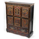 Tibetan lacquered Altar cabinet fitted with an arrangement of panelled doors and decorated with