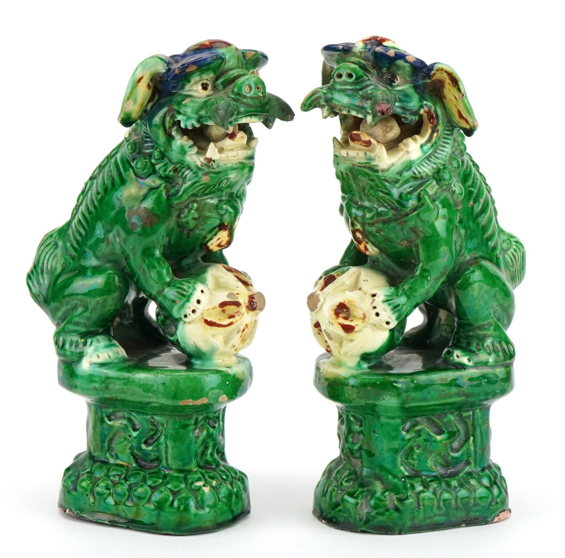 Pair of Chinese porcelain Foo dogs having sancai type glazes, each 24.5cm high : For further