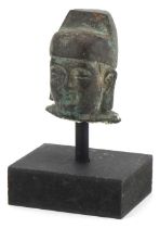 Chinese patinated bronze head of Buddha raised on a painted stand, overall 12.5cm high : For further