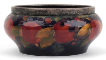 William Moorcroft pottery baluster fruit bowl with silver plated rim hand painted in the Pomegranate