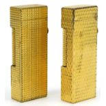 Two Dunhill gold plated pocket lighters with engine turned bodies : For further information on