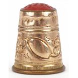 Yellow metal thimble with hardstone top, 2cm high, 3.7g : For further information on this lot please