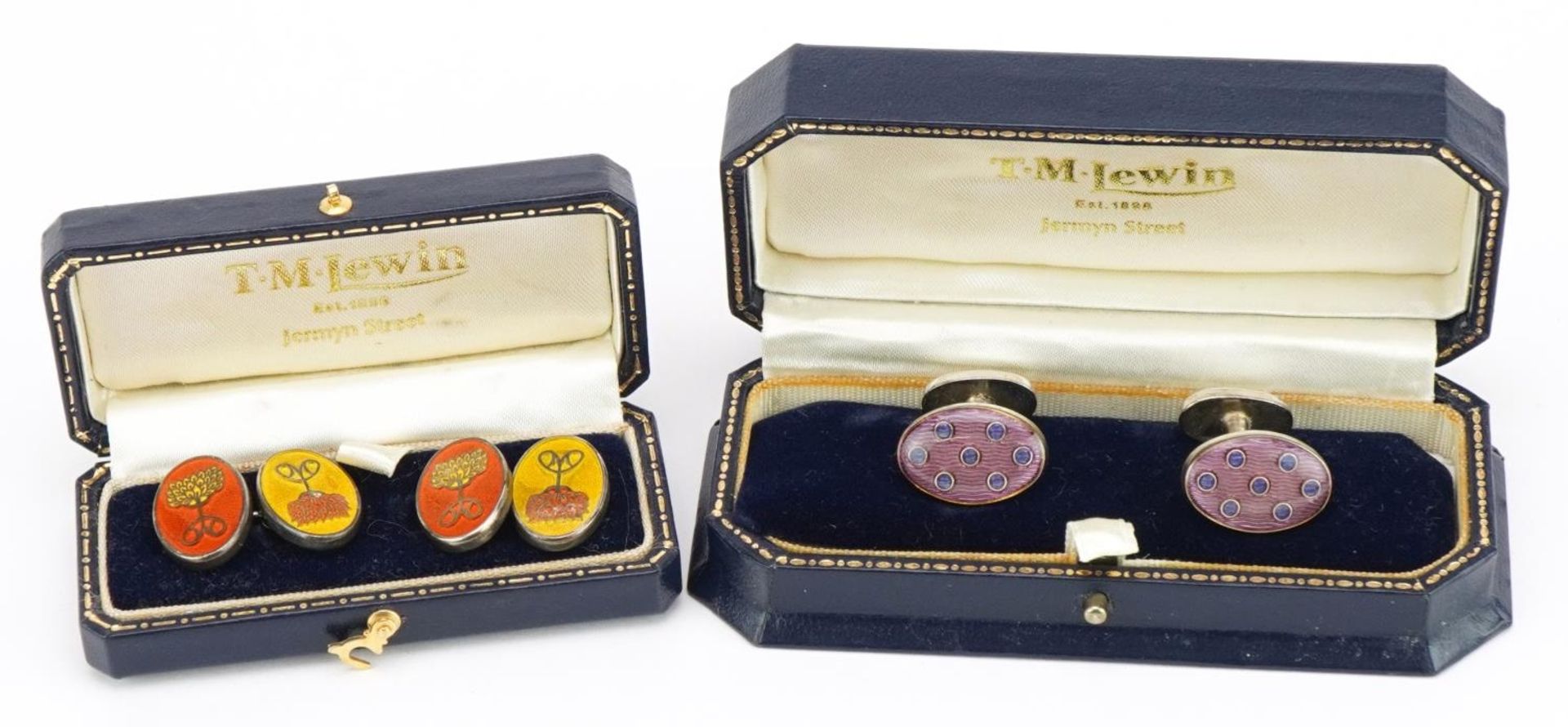 Two pairs of white metal and enamel cufflinks housed in T M Lewin fitted cases including a pair of