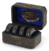 Boxed set of Stereoscopic Photographic Company lenses, 106 and 108 Regent Street, each 3cm in