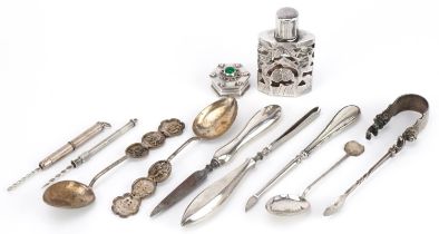 Silver and white metal objects including silver overlaid glass scent bottle, two silver propelling
