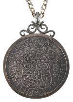 White metal coin housed in a sterling silver pendant mount engraved Treasure from Hollandia 1743, on