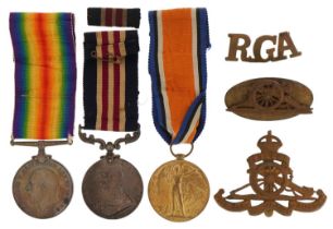 British military World War I three medal group with three cap badges relating to Sergeant H Blakeley