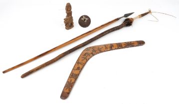 Tribal interest woodenware including a fertility figure and Aboriginal boomerang, the largest