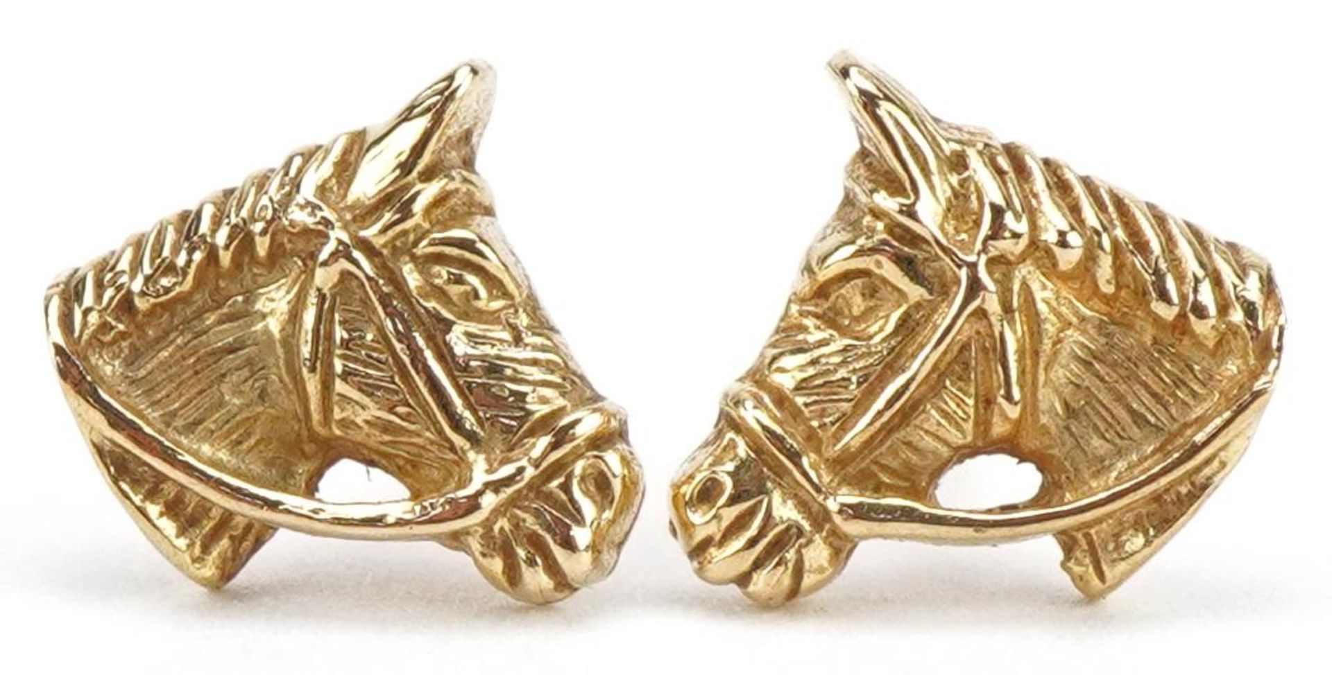 Pair of 9ct gold horsehead stud earrings, 8.5mm wide, 0.8g : For further information on this lot