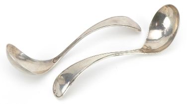 Pair of Continental Arts & Crafts beaten silver ladles impressed Z to the handle, 17cm in length,