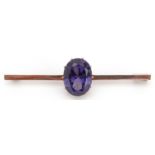 Unmarked gold alexandrite solitaire bar brooch, the stone approximately 14.3mm x 11.5mm x 7.0mm deep