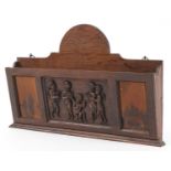 Early 20th century oak letter rack carved with Putti musicians, 46cm wide : For further