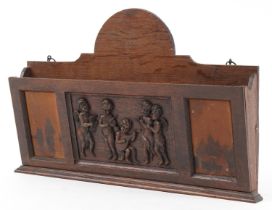 Early 20th century oak letter rack carved with Putti musicians, 46cm wide : For further