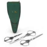 Graduated set of three French 19th century cut steel scissors by Nogent of France, housed in a