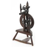 Antique carved oak spinning wheel, 78cm high : For further information on this lot please visit