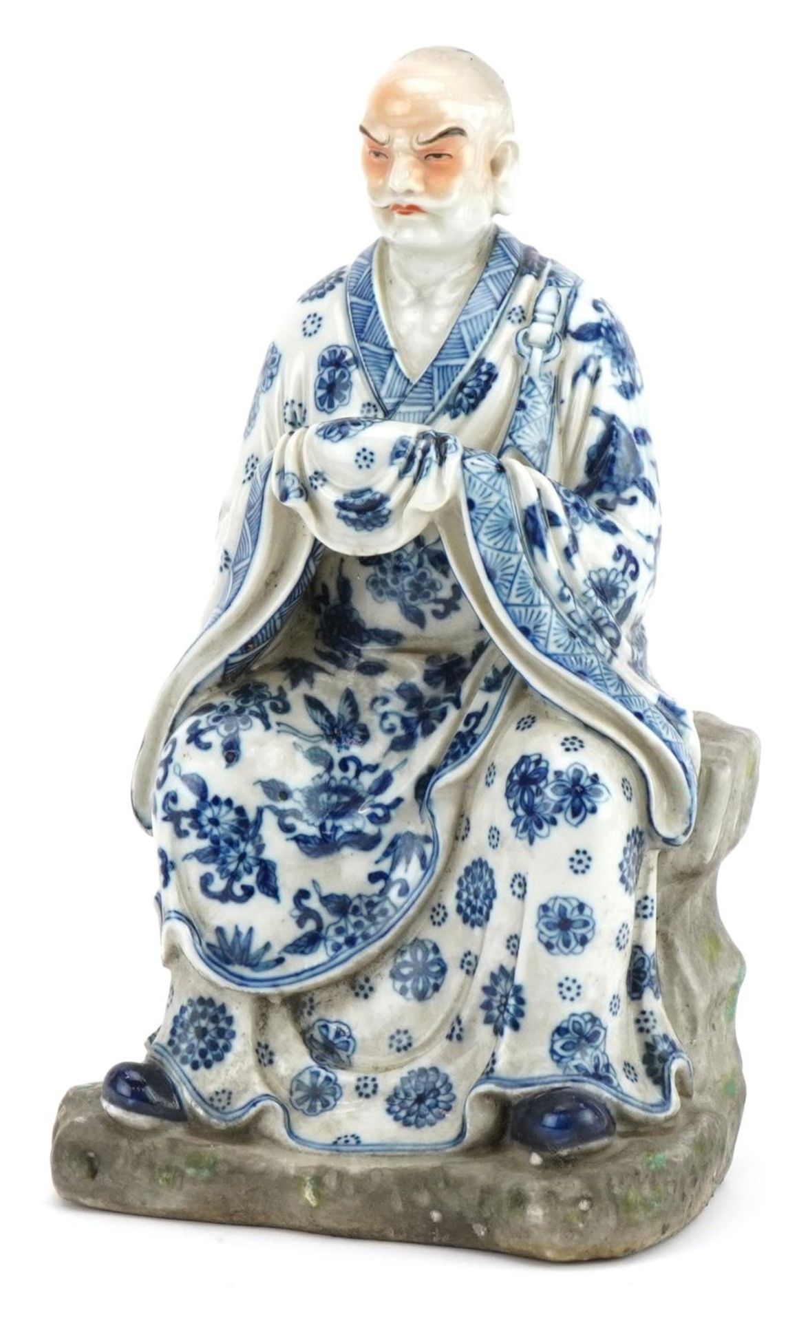 Chinese porcelain figure of an emperor wearing a blue and white robe, hand painted with flower