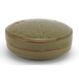 Korean porcelain bun box and cover having a celadon glaze, incised with flowers, 13cm in