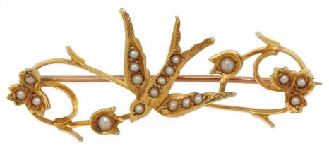 15ct gold seed pearl bar brooch in the form of a bird amongst flowers, 4.2cm wide, 3.7g : For