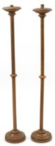 Pair of gilt painted floor standing altar candlesticks, 113cm high : For further information on this