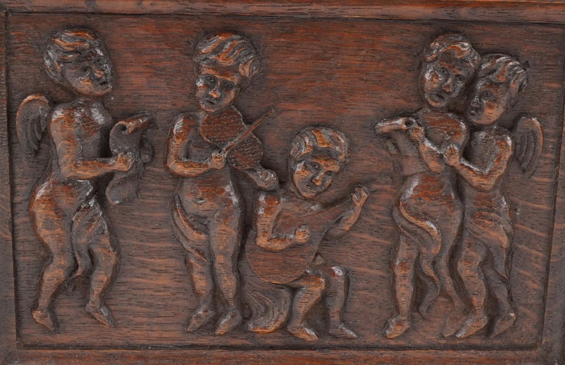 Early 20th century oak letter rack carved with Putti musicians, 46cm wide : For further - Image 3 of 5