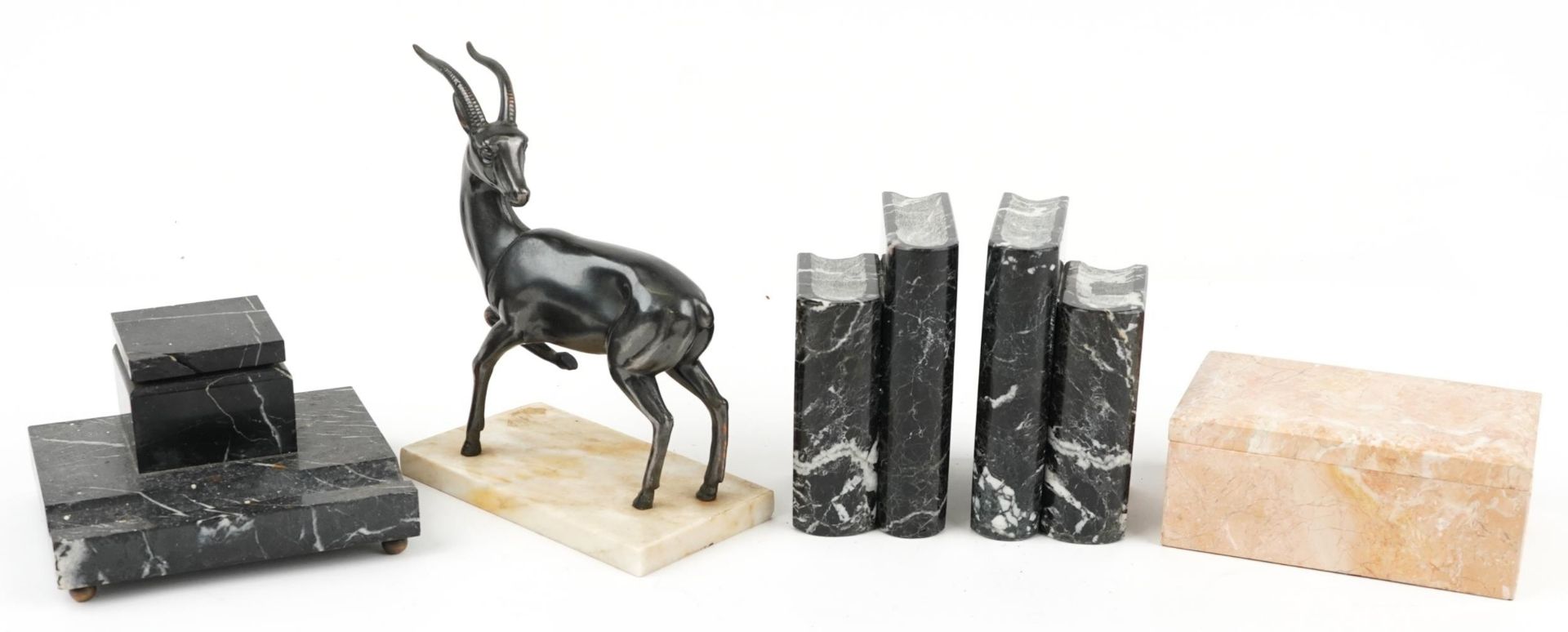 Art Deco style marble including bronzed gazelle sculpture, pair of book design bookends and inkwell,