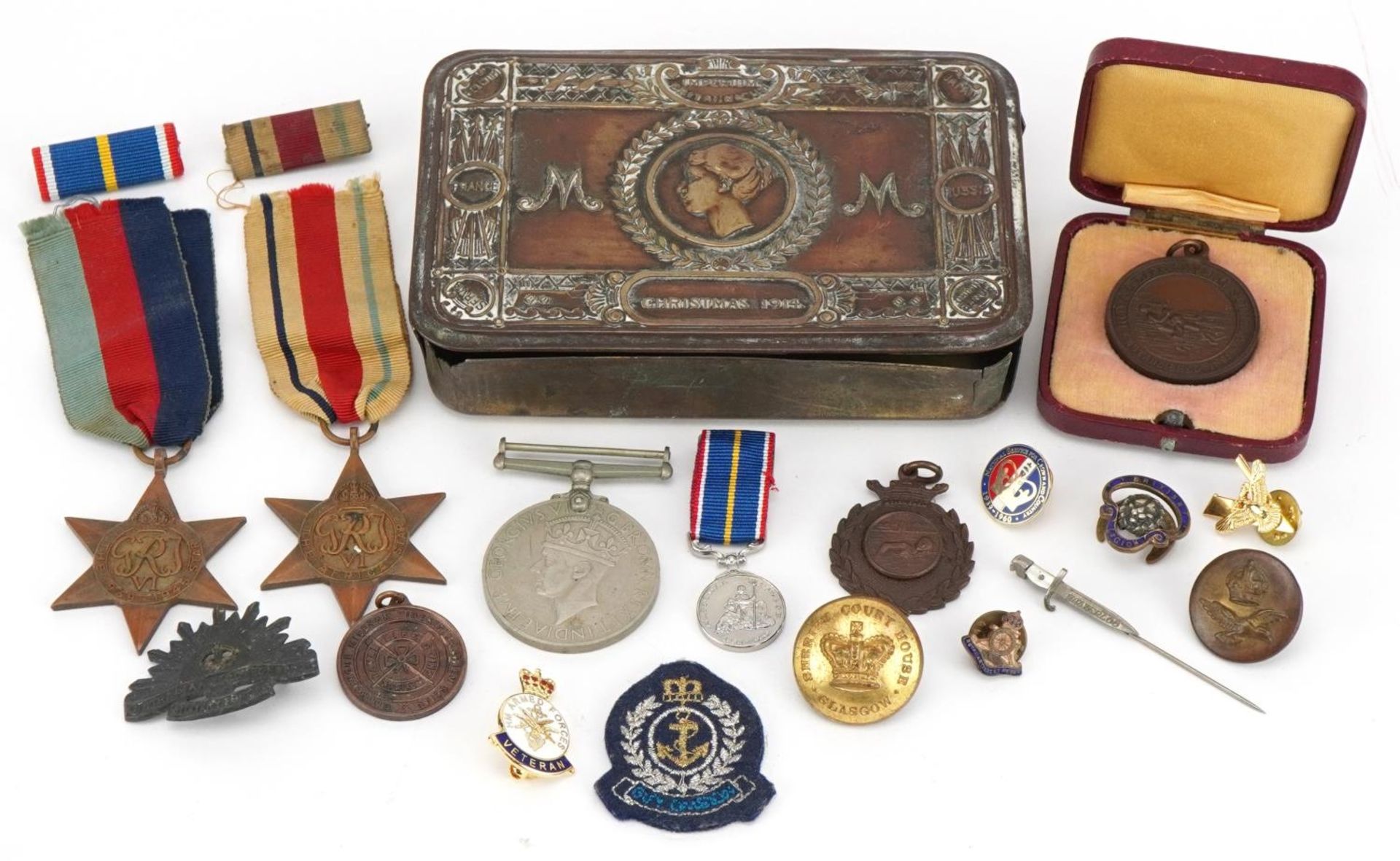 British military World War I Mary tin and various militaria including three World War II medals,