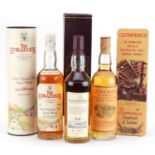Three bottles of whisky with boxes comprising Aultmore aged 12 years, Edradour aged 10 years and
