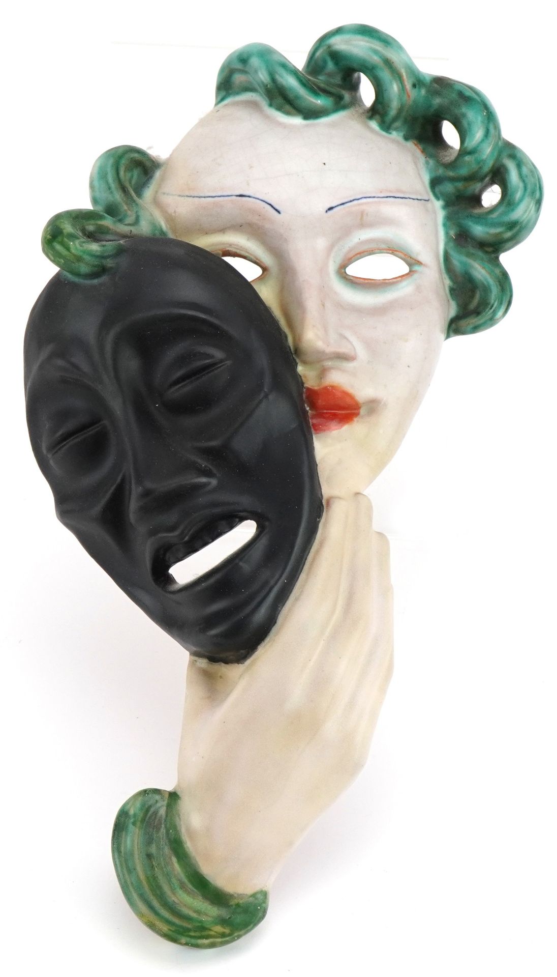 Goldschneider, Austrian Art Deco pottery facemask of a female holding a mask, factory stamp and