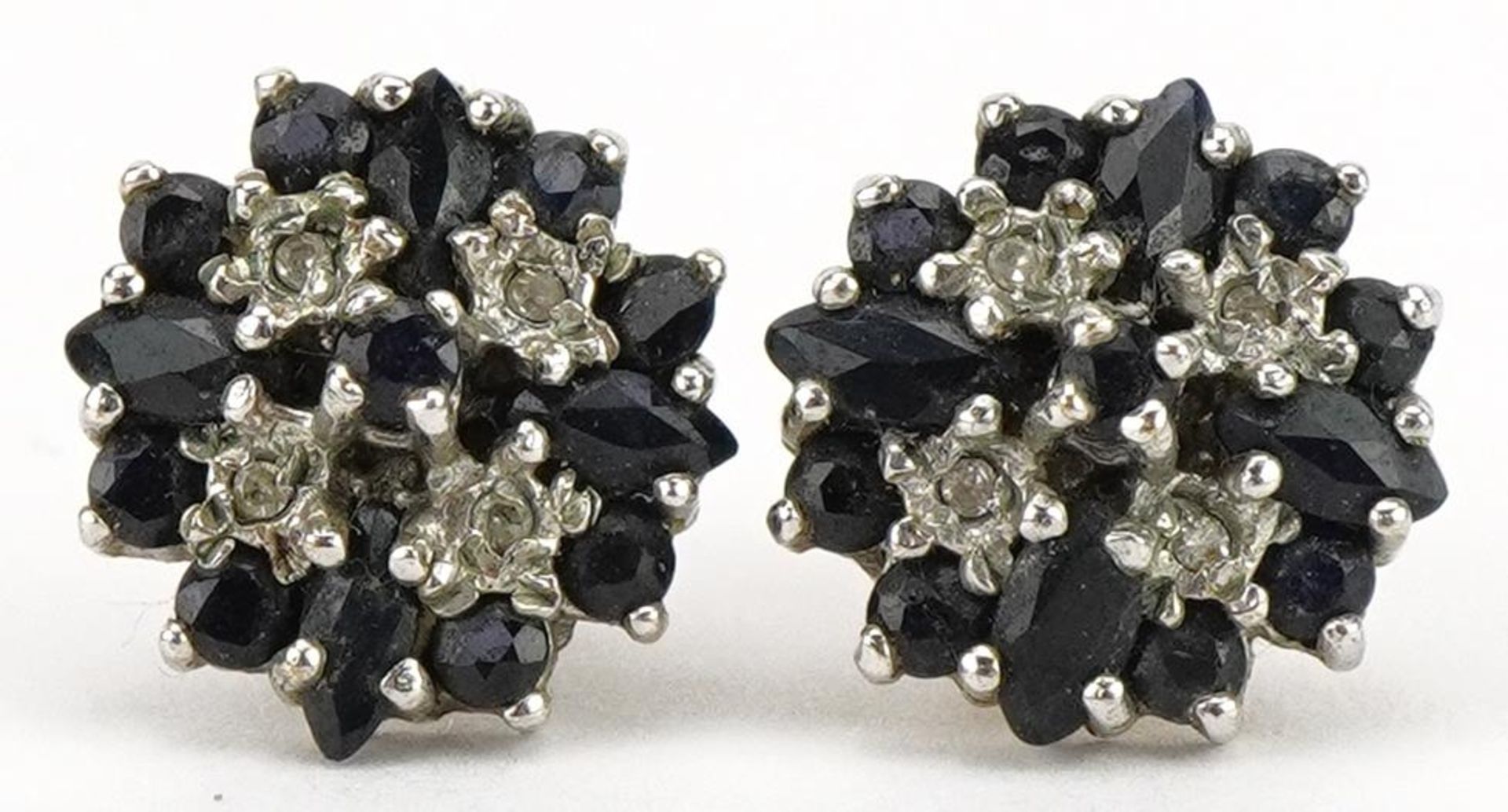Pair of 9ct gold diamond and sapphire cluster stud earrings, 1.1cm in diameter, 2.4g : For further