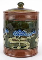 Royal Doulton, Art Nouveau stoneware tobacco jar and cover hand painted with stylised flowers,