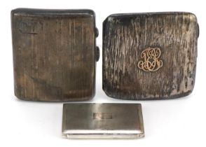 Two Edwardian and later silver cigarette cases and an engine turned silver compact, the largest 8.