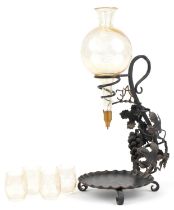 French wrought iron and glass wine decanter with four matching iridescent glasses etched with leaves