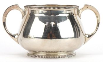 Mappin & Webb, Arts & Crafts silver sugar bowl with twin handles, Sheffield 1923, 14cm wide, 271.