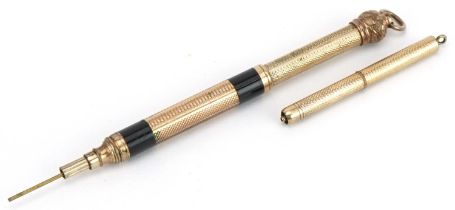 Two Victorian gold plated propelling pencils including one with black enamel, the largest 6cm in