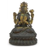 18th Century Chino Tibetan gilt bronze buddha of Sadaksari inset with turquoise cabochons, 16cm high