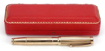 Early 20th century Mabie Todd & Co swan fountain pen with yellow metal case and 14ct gold nib housed